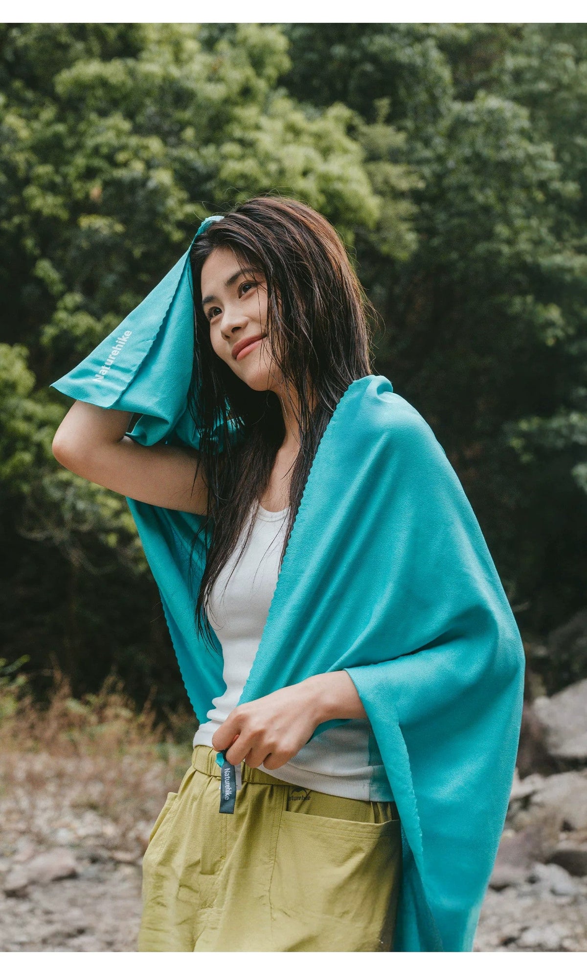 Included Lake Green Naturehike towel shown in outdoor use; original Naturehike fabric branding visible.