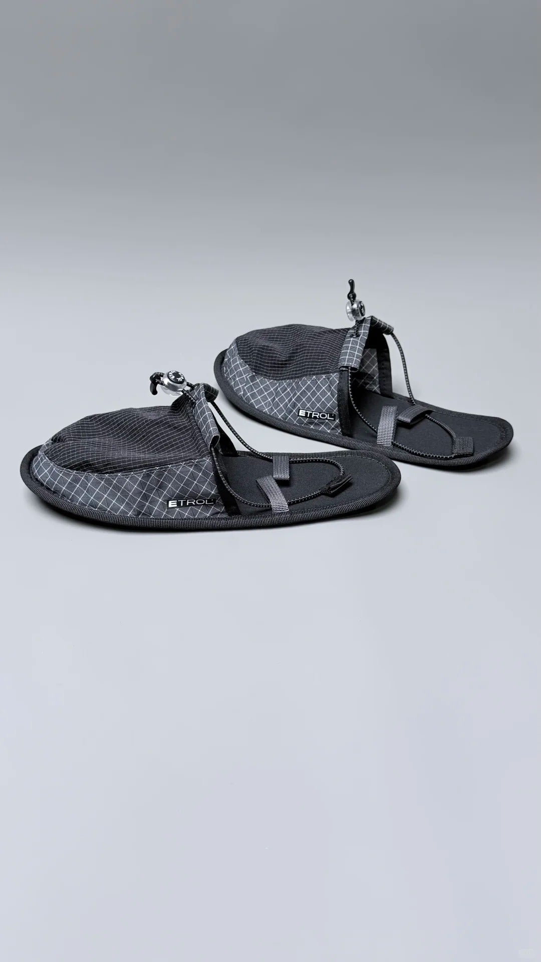 Flexible travel slippers folded flat for compact luggage storage