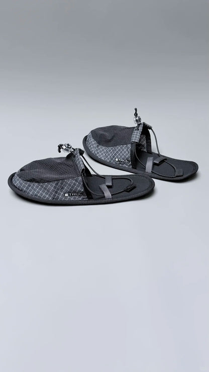 Flexible travel slippers folded flat for compact luggage storage