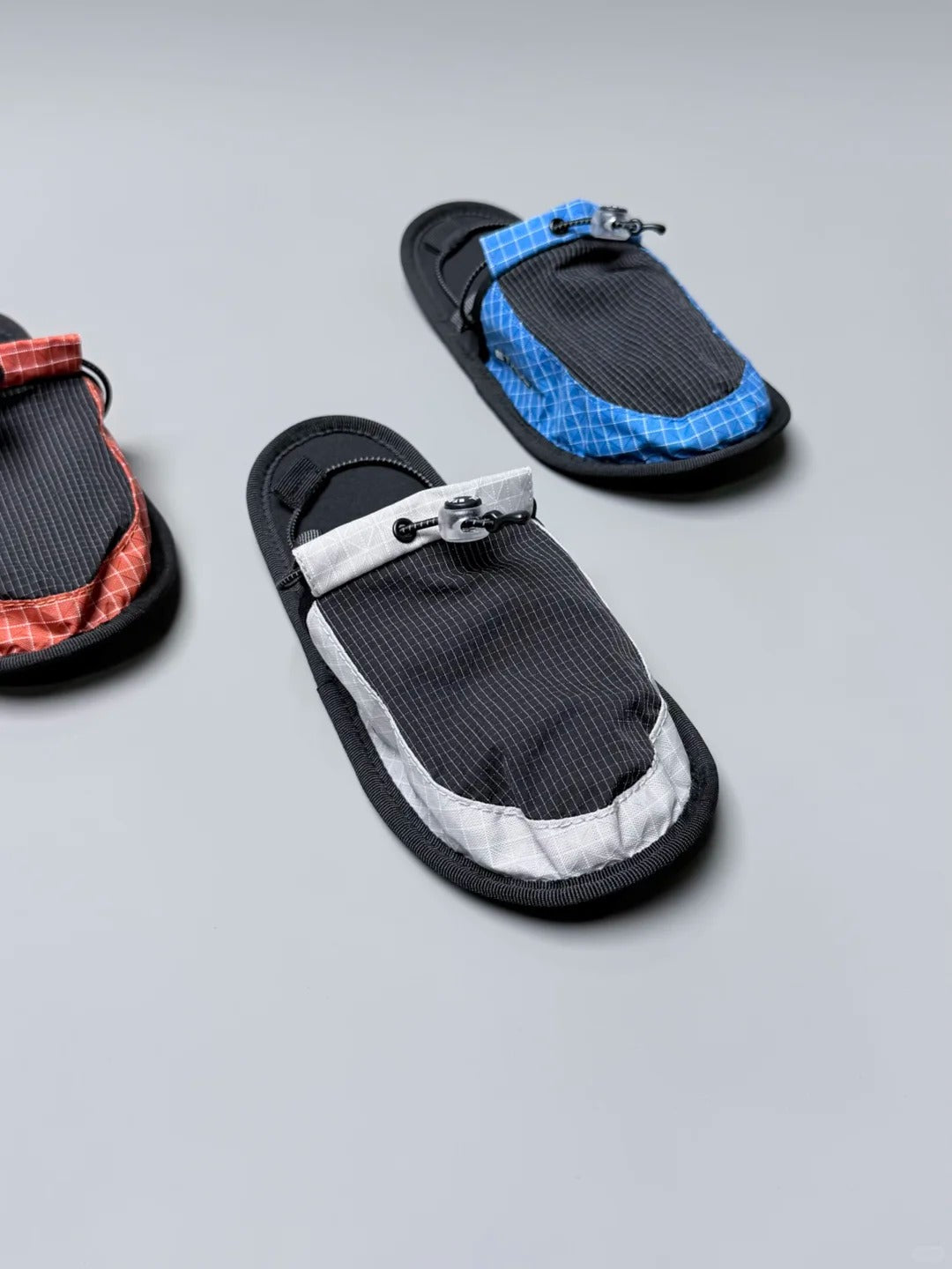 NOWYSM lightweight travel slippers with technical outdoor styling